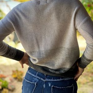 White cashmere sweater, very soft. Can be worn with jeans or dressed up.